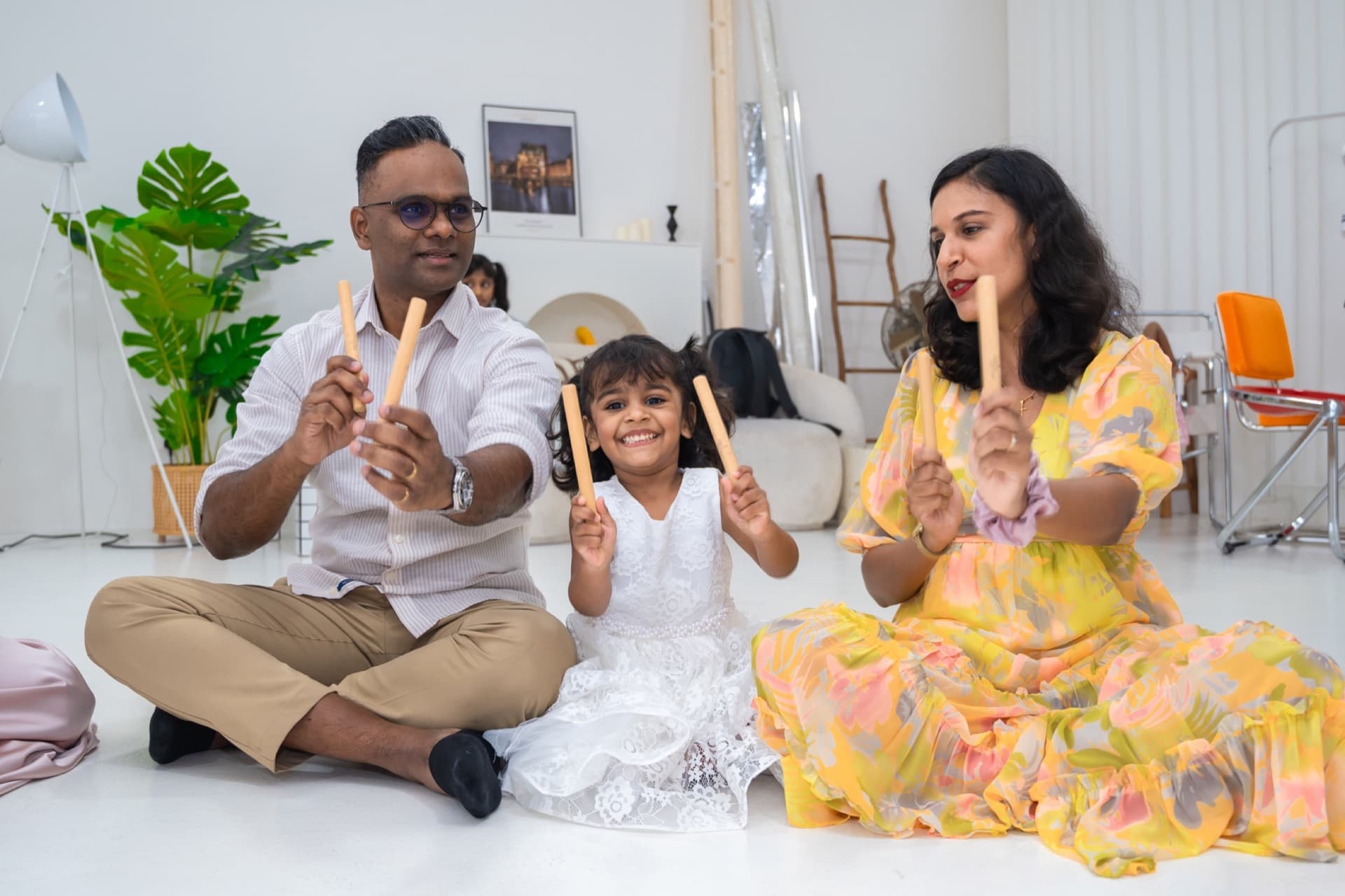 Parents and young children making music together during a Claviera Petite class.